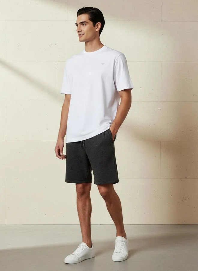 لي كوبر Lee Cooper Men Regular Fit Crew Neck Short Sleeves Badge Detail T-shirt